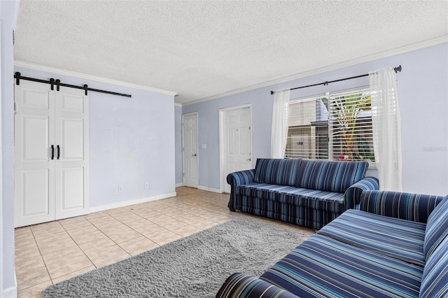 1813 Bough Ave Unit B, Clearwater, FL 33760 - living room with ornamental molding, a barn door, tile patterned floors, and a textured ceiling