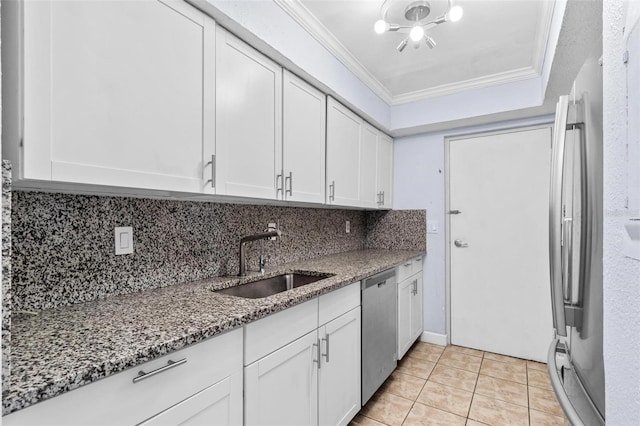 1813 Bough Ave Unit B, Clearwater, FL 33760 - kitchen with stainless steel appliances, ornamental molding, dark stone countertops, white cabinets, and light tile patterned floors
