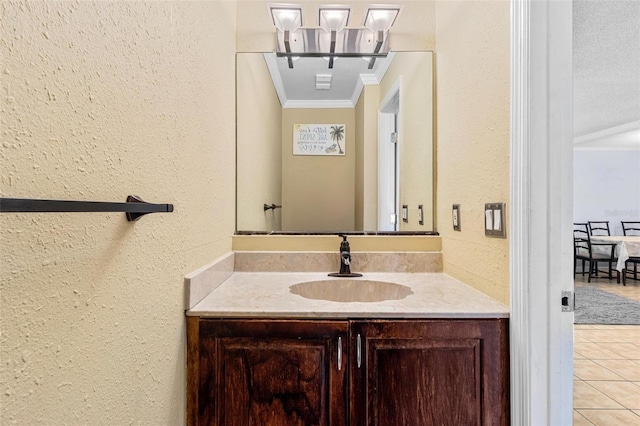 1813 Bough Ave Unit B, Clearwater, FL 33760 - bathroom with ornamental molding, a textured wall, vanity, tile patterned floors, and a chandelier