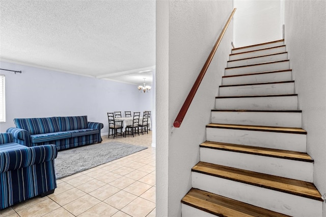 1813 Bough Ave Unit B, Clearwater, FL 33760 - stairs with tile patterned floors, a chandelier, and a textured ceiling