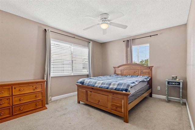 1813 Bough Ave Unit B, Clearwater, FL 33760 - bedroom featuring a textured ceiling, light carpet, and ceiling fan