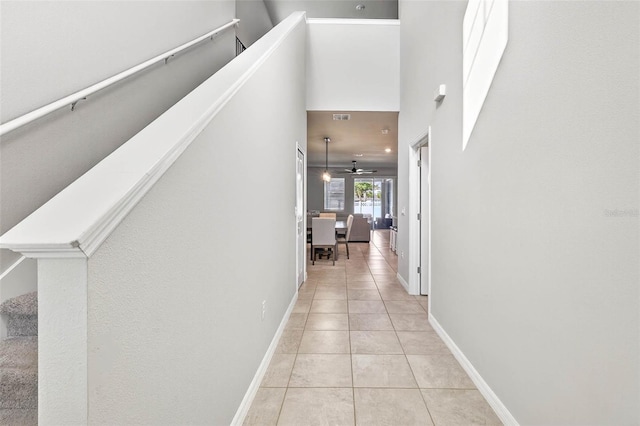 33854 Floating Heart Ct, Wesley Chapel, FL 33545 - hallway with light tile patterned flooring and a high ceiling