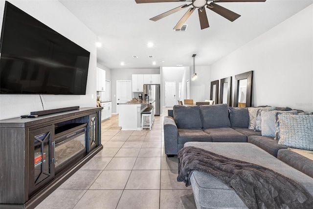 33854 Floating Heart Ct, Wesley Chapel, FL 33545 - living area featuring a ceiling fan, light tile patterned floors, and recessed lighting