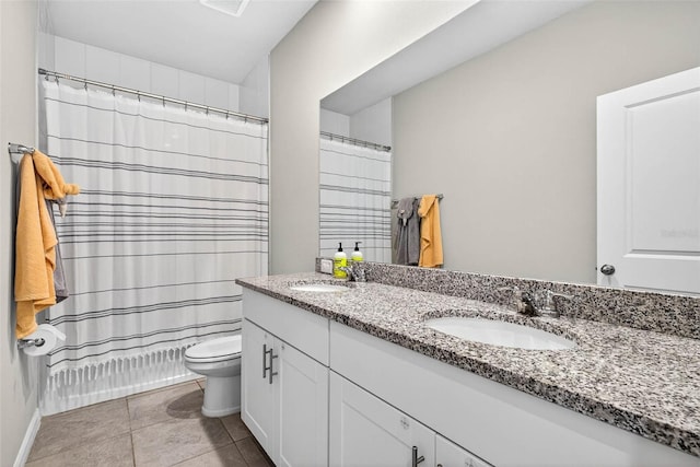 33854 Floating Heart Ct, Wesley Chapel, FL 33545 - full bathroom with double vanity, tile patterned flooring, and a shower with shower curtain