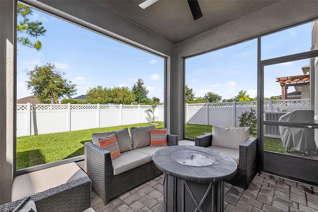 33854 Floating Heart Ct, Wesley Chapel, FL 33545 - sunroom featuring ceiling fan and an outdoor living space