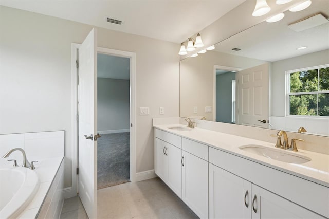 12758 Oak Hill Way, Parrish, FL 34219 - full bath with double vanity, a garden tub, and tile patterned floors