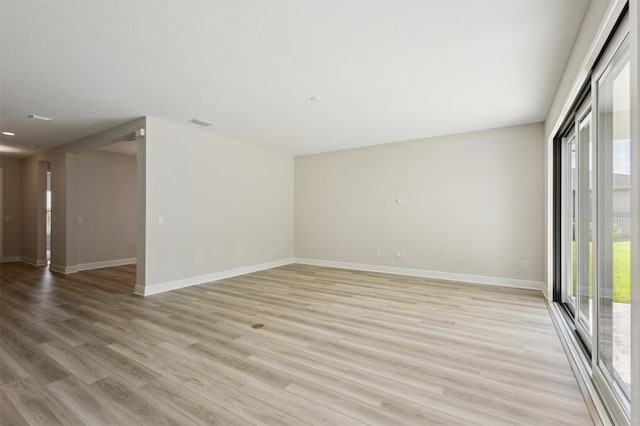 12758 Oak Hill Way, Parrish, FL 34219 - unfurnished room with baseboards and light wood-style floors