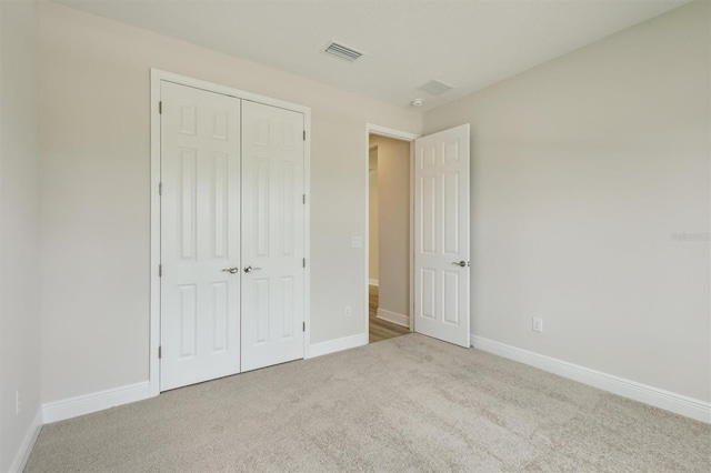 12758 Oak Hill Way, Parrish, FL 34219 - unfurnished bedroom with carpet and a closet