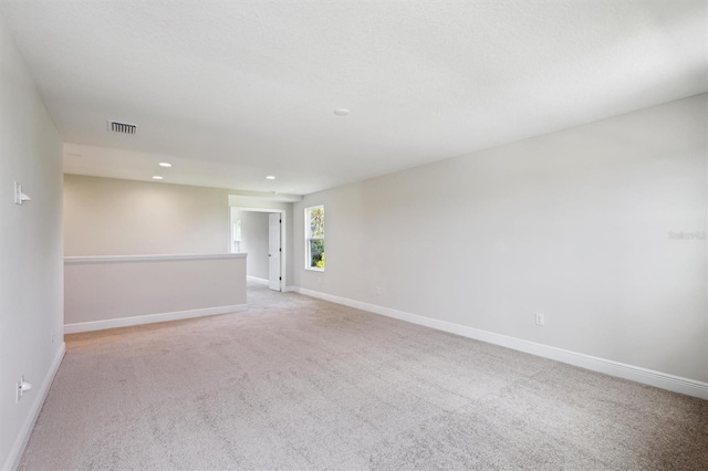 12758 Oak Hill Way, Parrish, FL 34219 - spare room featuring recessed lighting and light carpet