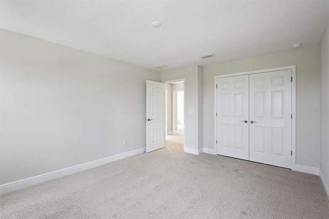12758 Oak Hill Way, Parrish, FL 34219 - unfurnished bedroom featuring carpet and a closet