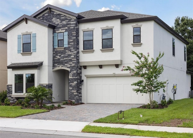 12758 Oak Hill Way, Parrish, FL 34219 - view of front of home featuring stucco siding, stone siding, and a garage