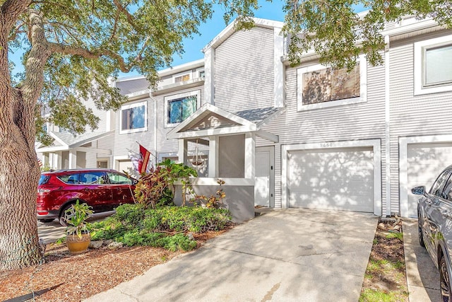 9660 Tara Cay Ct Unit 38, Seminole, FL 33776 - multi unit property with an attached garage and concrete driveway