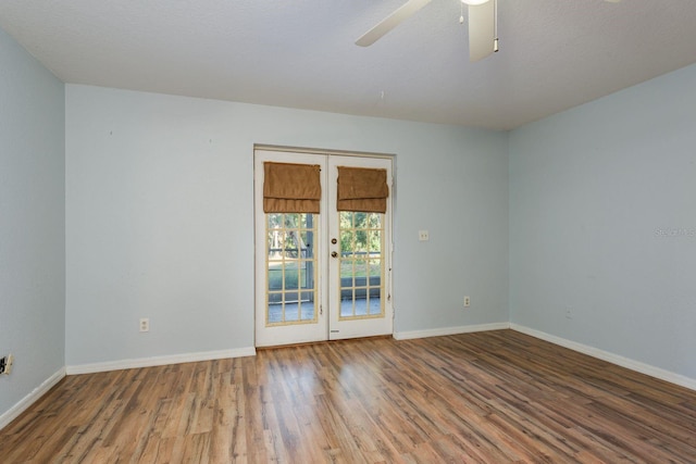 9660 Tara Cay Ct Unit 38, Seminole, FL 33776 - unfurnished room with wood finished floors, a ceiling fan, and french doors