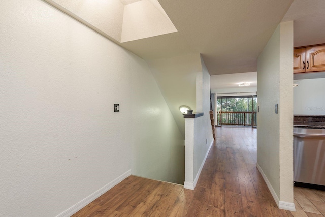 9660 Tara Cay Ct Unit 38, Seminole, FL 33776 - corridor featuring wood-type flooring and baseboards