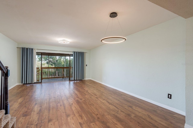 9660 Tara Cay Ct Unit 38, Seminole, FL 33776 - unfurnished room featuring baseboards and wood finished floors
