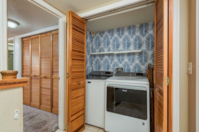 9660 Tara Cay Ct Unit 38, Seminole, FL 33776 - laundry area with washer and dryer and a textured ceiling