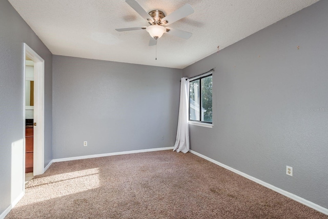 9660 Tara Cay Ct Unit 38, Seminole, FL 33776 - empty room with carpet floors, ceiling fan, and a textured ceiling