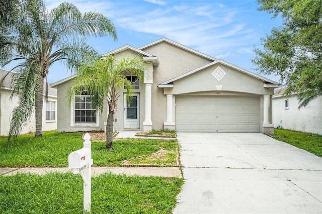 10039 Creek Bluff Dr, Riverview, FL 33578 - view of front of property with concrete driveway, stucco siding, and an attached garage