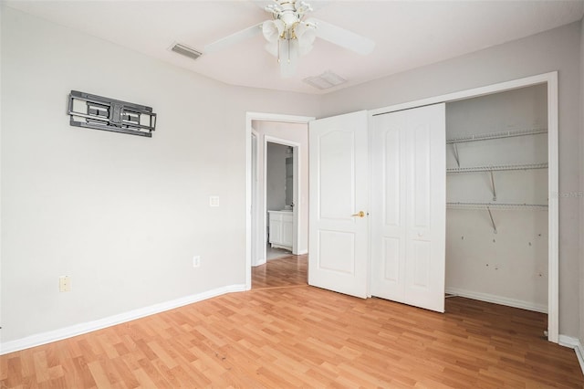 10039 Creek Bluff Dr, Riverview, FL 33578 - unfurnished bedroom featuring light wood-style floors, a closet, and ceiling fan