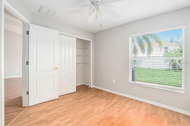 10039 Creek Bluff Dr, Riverview, FL 33578 - unfurnished bedroom with light wood-type flooring, a closet, and a ceiling fan