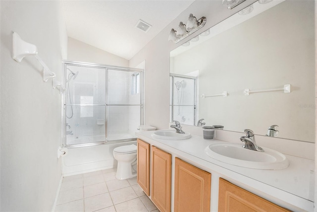 10039 Creek Bluff Dr, Riverview, FL 33578 - full bath with tile patterned flooring, bath / shower combo with glass door, double vanity, and lofted ceiling