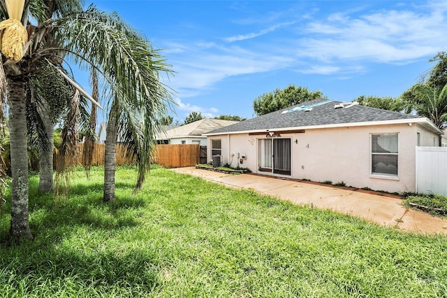 10039 Creek Bluff Dr, Riverview, FL 33578 - back of house with stucco siding, a shingled roof, and a patio area