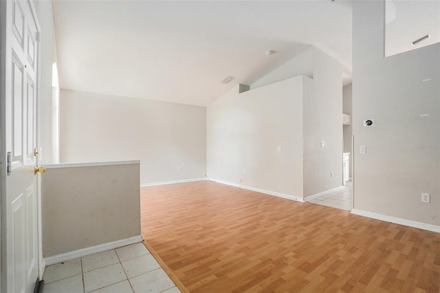 10039 Creek Bluff Dr, Riverview, FL 33578 - empty room featuring lofted ceiling and light wood finished floors