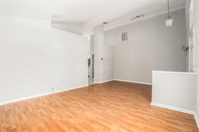 10039 Creek Bluff Dr, Riverview, FL 33578 - empty room with light wood-style floors and high vaulted ceiling