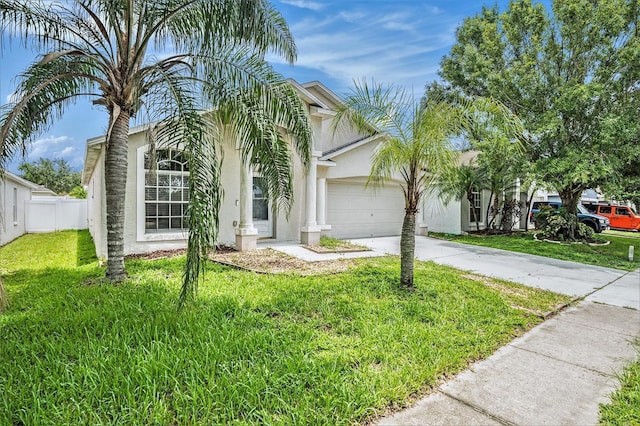 10039 Creek Bluff Dr, Riverview, FL 33578 - view of front of property with stucco siding, a garage, and driveway