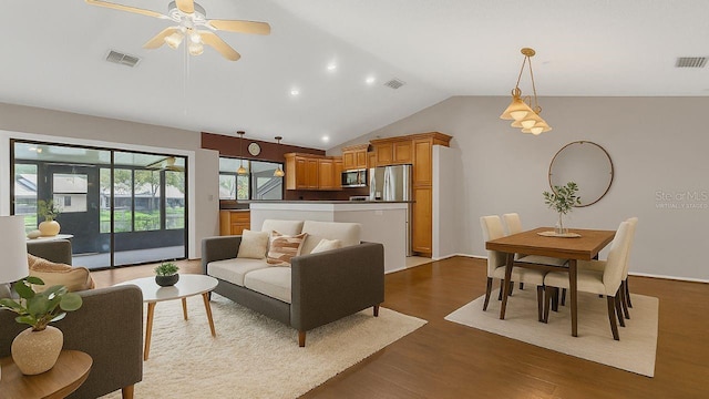3902 Shoreside Cir, Tampa, FL 33624 - living area featuring dark wood finished floors, vaulted ceiling, ceiling fan, and recessed lighting