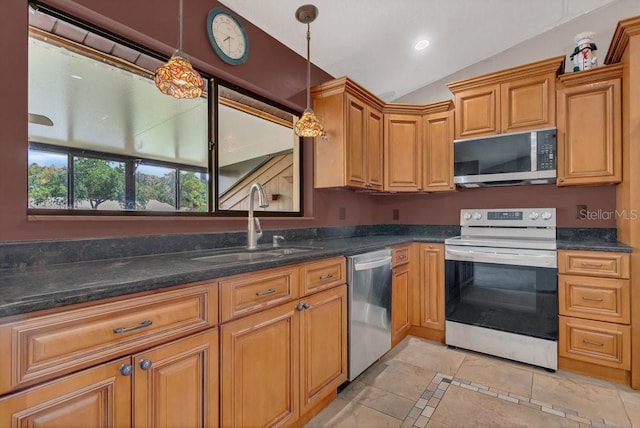 3902 Shoreside Cir, Tampa, FL 33624 - kitchen featuring stainless steel appliances, lofted ceiling, decorative light fixtures, inlaid floor details, and brown cabinetry