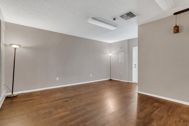 3902 Shoreside Cir, Tampa, FL 33624 - empty room with wood finished floors and a textured ceiling