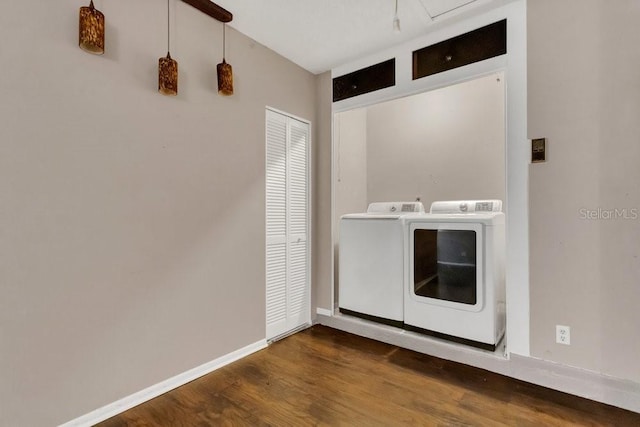 3902 Shoreside Cir, Tampa, FL 33624 - laundry area with washing machine and dryer and wood finished floors