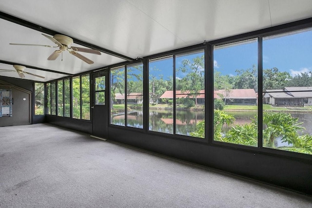 3902 Shoreside Cir, Tampa, FL 33624 - unfurnished sunroom with carpet floors and a water view