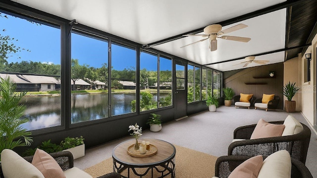 3902 Shoreside Cir, Tampa, FL 33624 - sunroom / solarium featuring carpet flooring, a water view, a ceiling fan, and wood walls