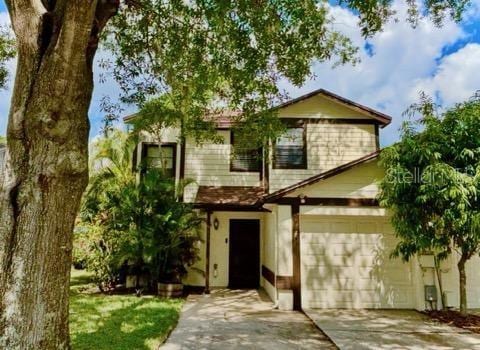 5110 Corvette Dr, Tampa, FL 33624 - view of front of property featuring driveway and a garage