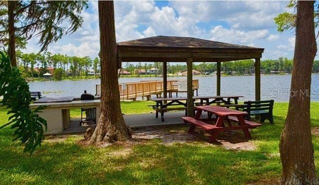 5110 Corvette Dr, Tampa, FL 33624 - dock area featuring a water view, a gazebo, and a lawn