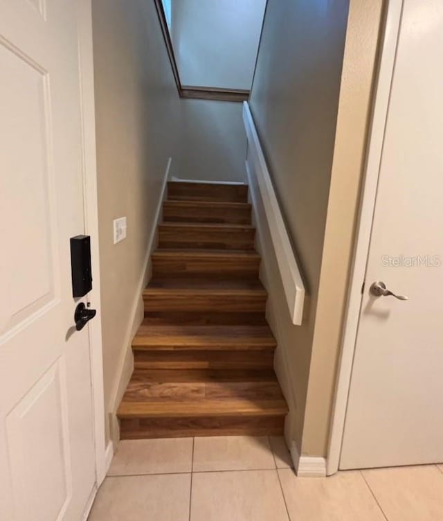 5110 Corvette Dr, Tampa, FL 33624 - stairs with tile patterned flooring and baseboards