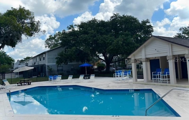 5110 Corvette Dr, Tampa, FL 33624 - community pool featuring a patio and an outdoor structure