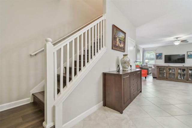 28568 Tranquil Lake Cir, Wesley Chapel, FL 33543 - staircase featuring a ceiling fan and tile patterned floors