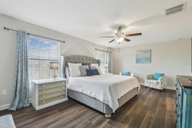 28568 Tranquil Lake Cir, Wesley Chapel, FL 33543 - bedroom featuring dark wood-type flooring and a ceiling fan