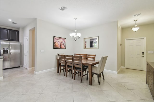 28568 Tranquil Lake Cir, Wesley Chapel, FL 33543 - dining area with light tile patterned floors and a chandelier