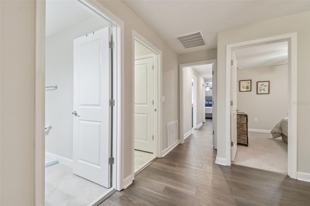 28568 Tranquil Lake Cir, Wesley Chapel, FL 33543 - corridor featuring wood finished floors and baseboards