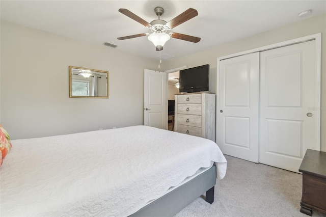 28568 Tranquil Lake Cir, Wesley Chapel, FL 33543 - bedroom featuring light colored carpet, a closet, and a ceiling fan
