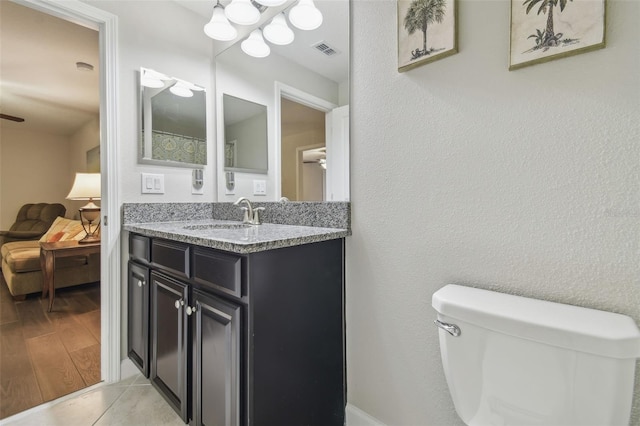 28568 Tranquil Lake Cir, Wesley Chapel, FL 33543 - bathroom featuring vanity, a ceiling fan, and a chandelier