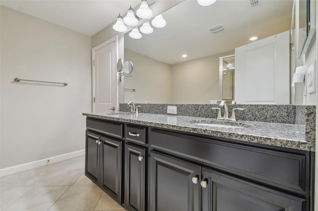 28568 Tranquil Lake Cir, Wesley Chapel, FL 33543 - bathroom with double vanity and tile patterned floors