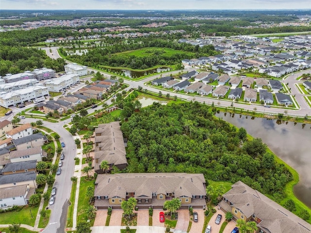 28568 Tranquil Lake Cir, Wesley Chapel, FL 33543 - aerial view of property and surrounding area featuring nearby suburban area and a large body of water