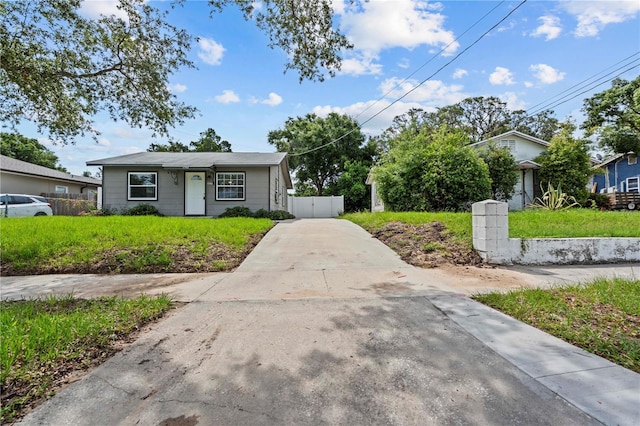 1743 Fulton Ave, Clearwater, FL 33755 - bungalow-style home featuring concrete driveway and a gate