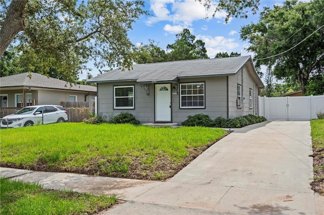 1743 Fulton Ave, Clearwater, FL 33755 - bungalow-style house featuring a gate and concrete driveway