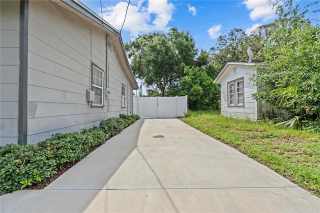 1743 Fulton Ave, Clearwater, FL 33755 - view of side of home with a gate